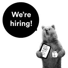 Bear holding a mug and a tablet open to CLIO with a bubble above her that says "we're hiring."