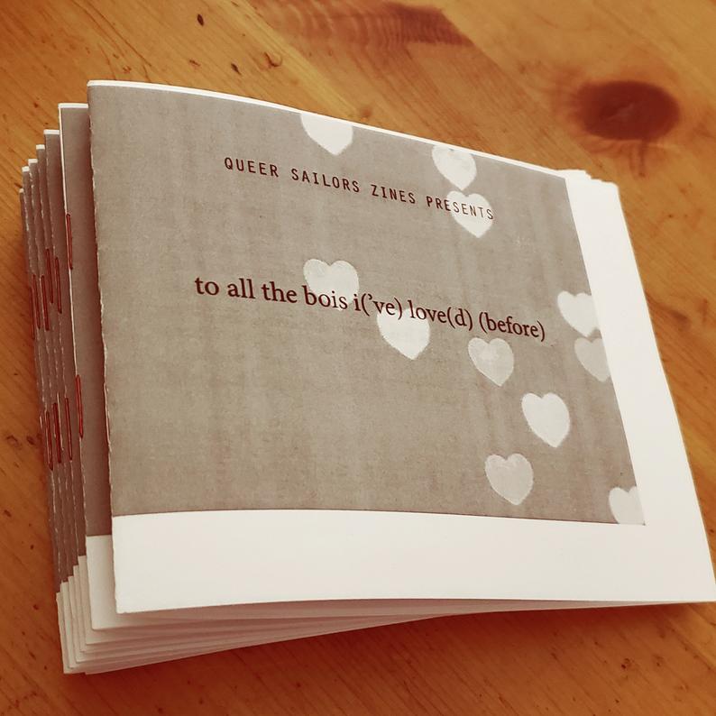 photo of zines: To All the Bois I('ve) Love(d) (Before). lowercase title, dark grey background, lighter gray hearts