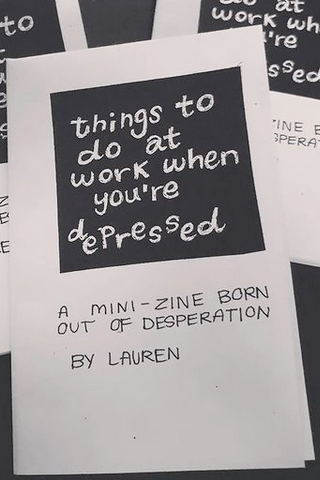 photo of zine cover: handwritten title in white in a black box