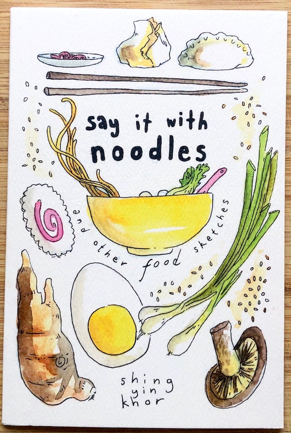 photo of a zine cover: drawings of noodle soup ingredients--scallions, egg, mushrooms, ginger