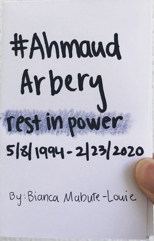 photo of zine: #AhmaudArbery Rest in Power, and the creator's thumb holding the zine