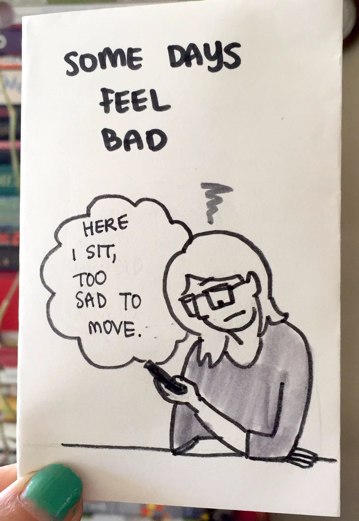 zine cover: Some Days Feel Bad. Drawing of person looking at phone, looking unhappy. 