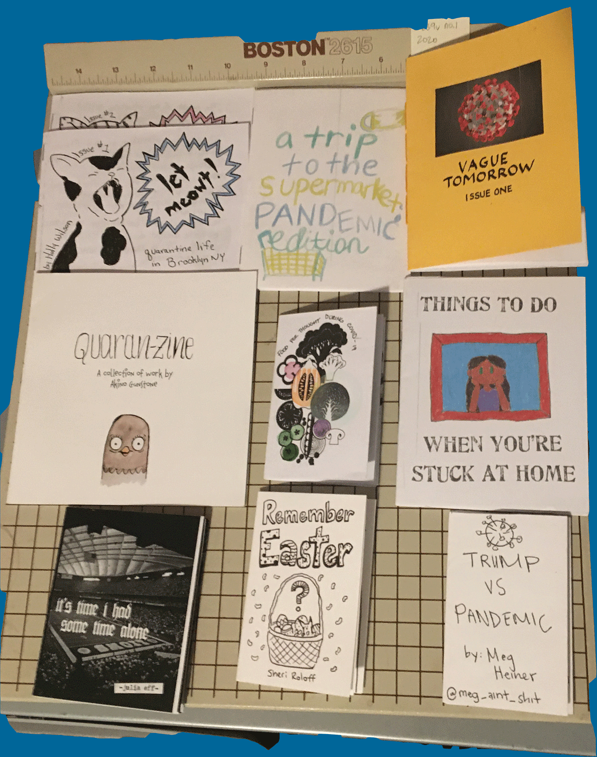 photo of all of the zines listed, lying on a papercutter