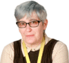 photo of a middle aged white woman with short bluish hear, wearing glasses and a bit of a smirk